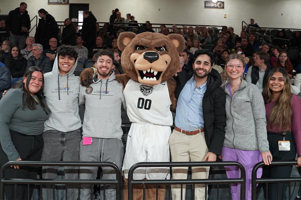 An image of OUWB students and the OU mascot